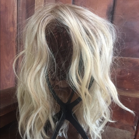 Natural looking synthetic wig. Never been worn.